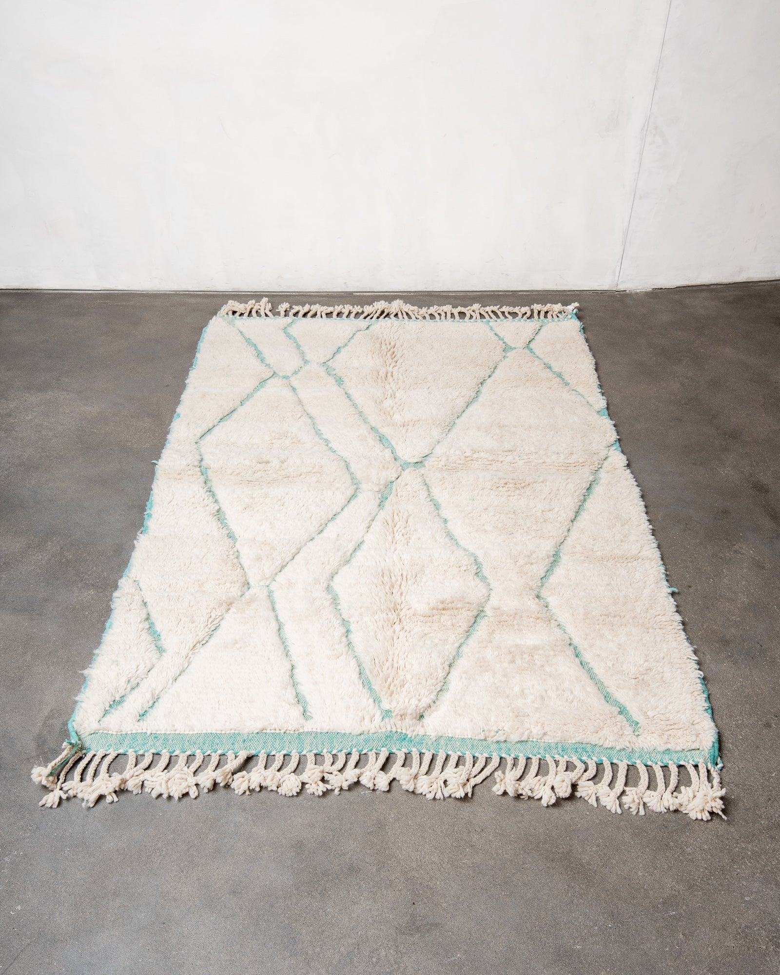 Modern, designer, handcrafted Berber rug from Morocco. Beniourain carpet with beautiful colours and patterns and fluffy wool texture.
